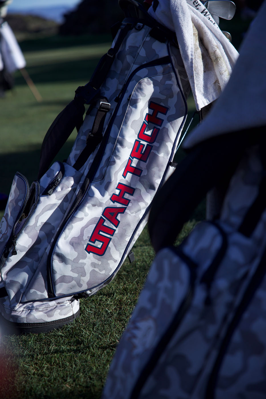 A golf bag on a course.