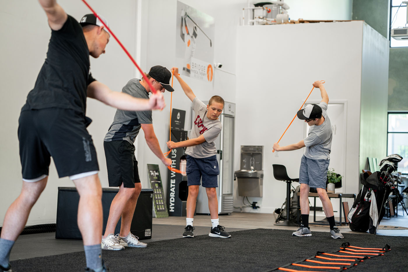 An image of a group of kids playing golf for a party event.